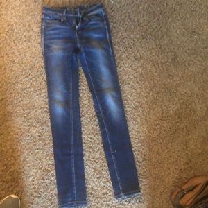 Buckle skinny jeans